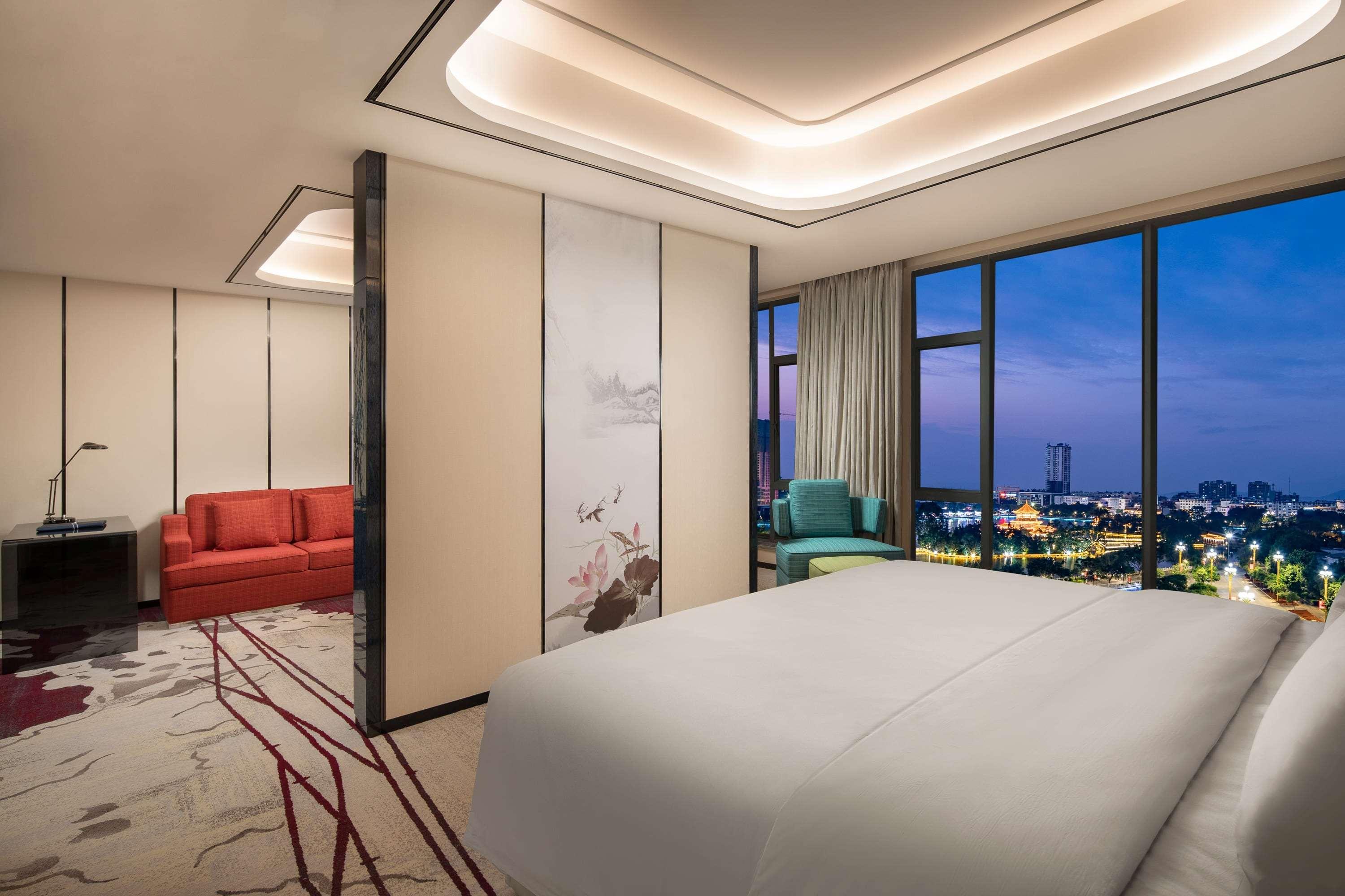 Ramada By Wyndham Mengzi Suites Exteriör bild
